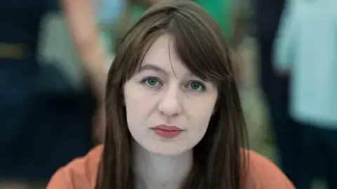 Irish author Sally Rooney declares she is unable to travel to the UK because of potential arrest